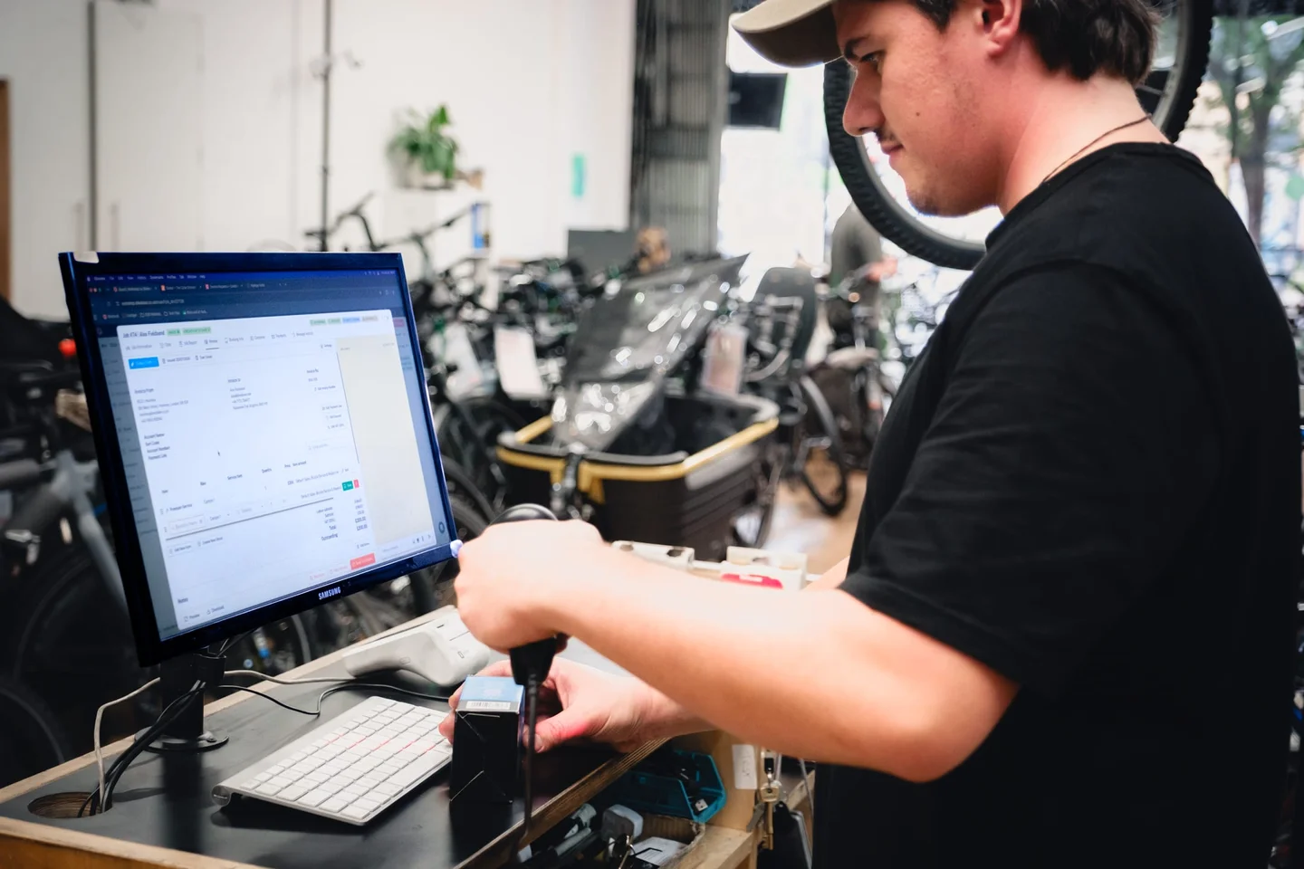 A mechanic fitting a part at the stand